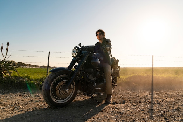 Full shot man riding a motorbike