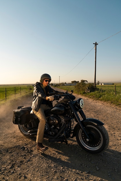 Full shot man riding a motorbike