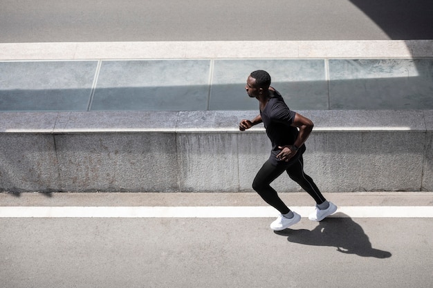 Free photo full shot man running outdoors