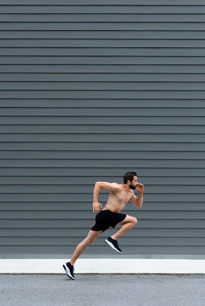 Full shot man running outdoors