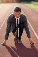 Free photo full shot man running in suit