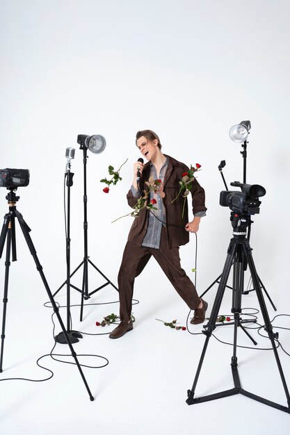 Full shot man singing with flowers