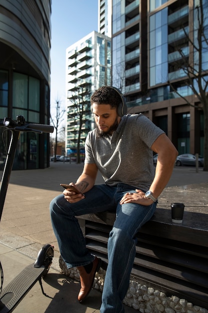 Full shot man sitting on bench