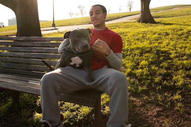 Free photo full shot man sitting on bench