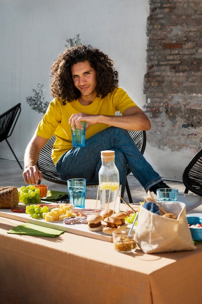 Full shot man sitting on chair