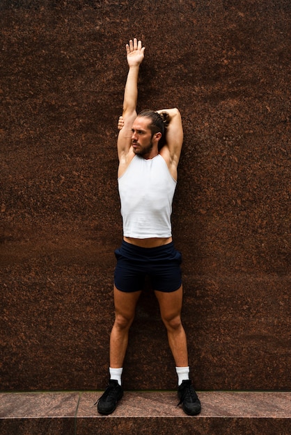 Full shot of man stretching