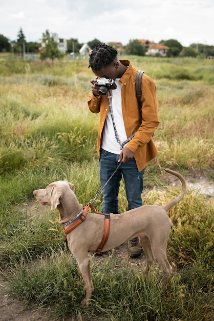 Full shot man taking photos outdoors