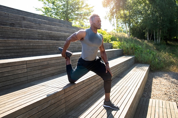 Full shot man training in park