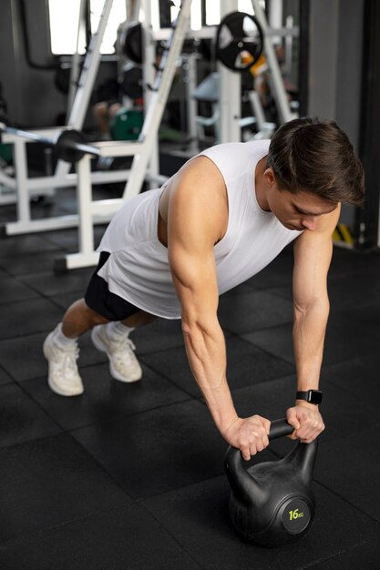 Full shot man training with kettlebell