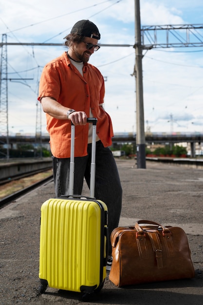 Full shot man traveling with baggage