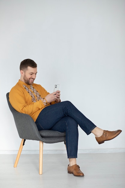 Full shot man wearing embroidered shirt