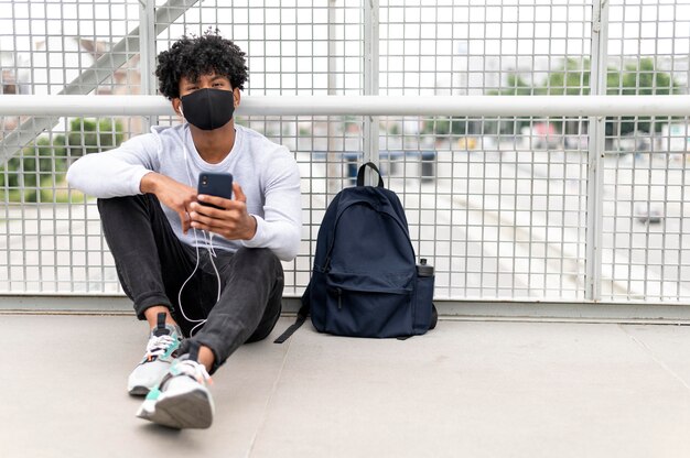 Full shot man wearing face mask