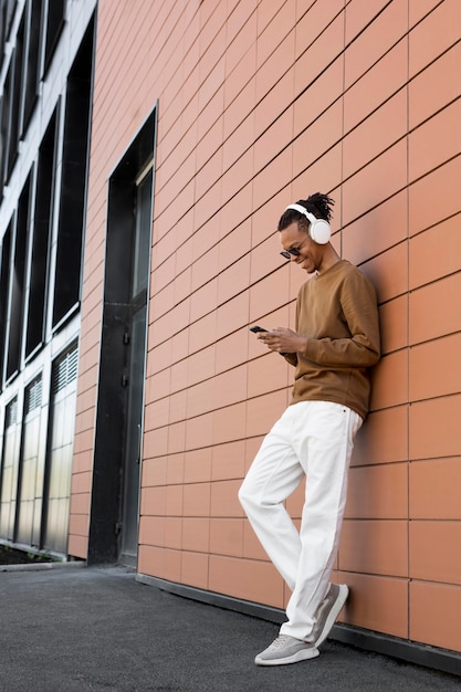 Full shot man wearing headphones