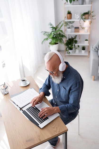 Full shot man wearing headphones