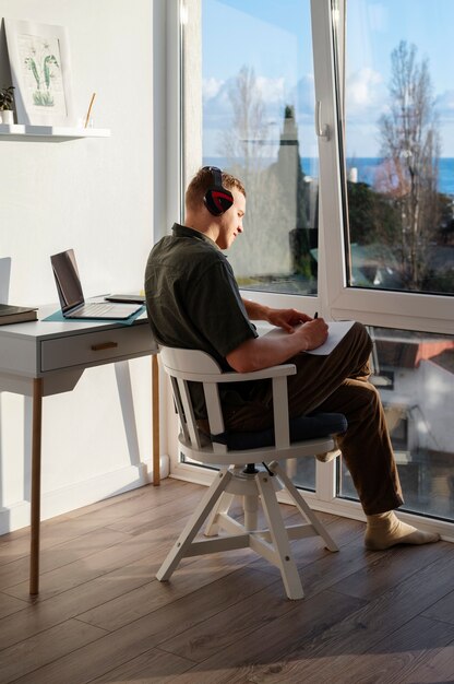 Full shot man wearing headphones