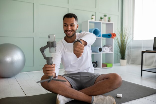 Full shot man with device