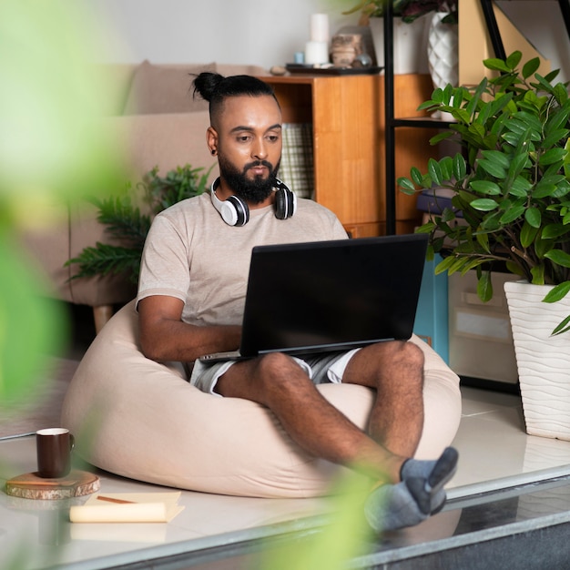 Full shot man with laptop working