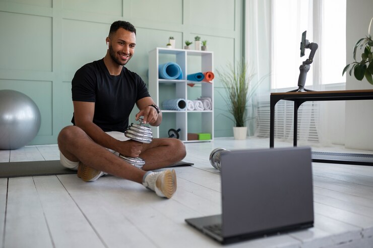 Free Photo full shot man with laptop