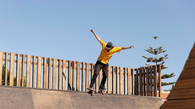 Full shot man with skateboard