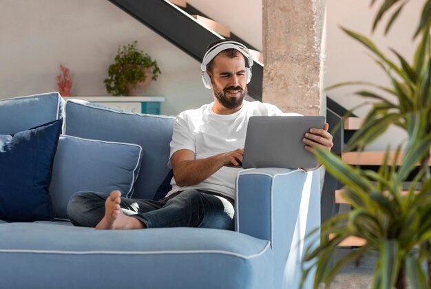 Full shot man working on couch