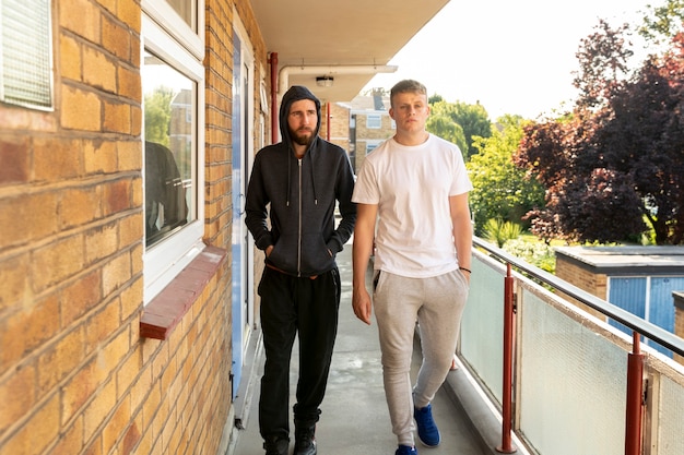 Full shot men on balcony