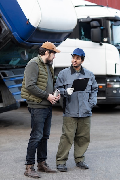 Full shot men discussing document