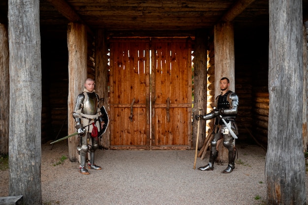 Free photo full shot men posing as medieval soldiers