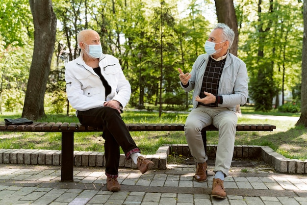 Full shot men wearing face masks