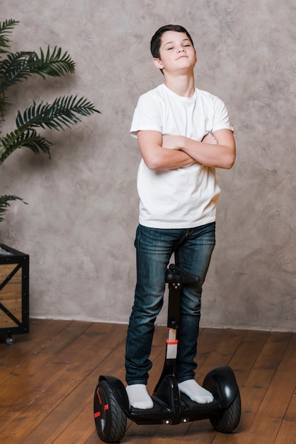 Free photo full shot of modern boy on hoverboard