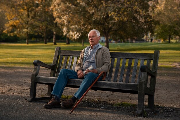 Full shot old man sitting on bench