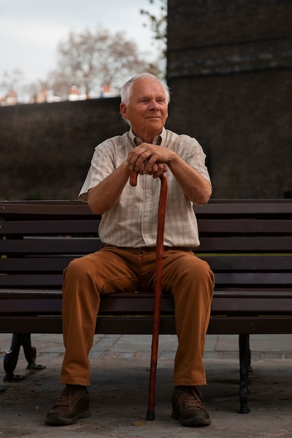 Full shot old man sitting on bench