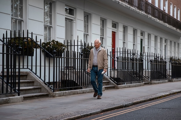 Full shot old man taking a stroll