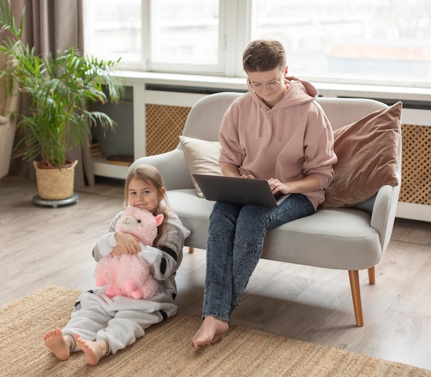 Full shot parent working at home