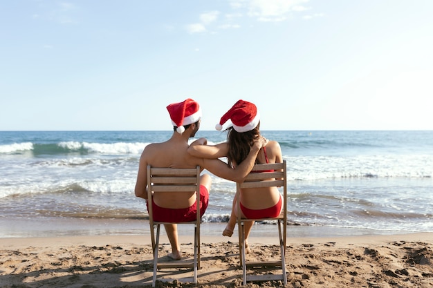 Free photo full shot partners sitting on chairs