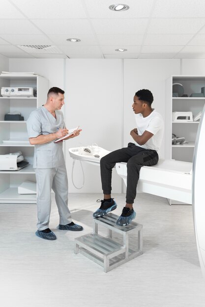 full shot patient talking about back pain