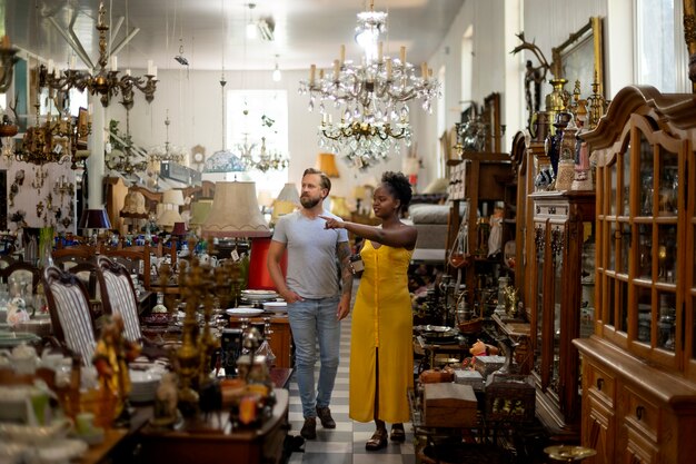 Full shot people at the antique store