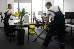 Free photo full shot people cleaning office