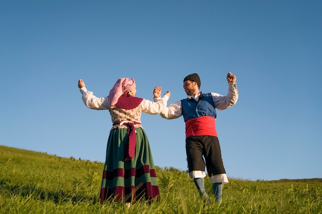 Full shot people dancing outdoors