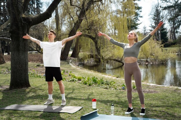 Full shot people exercising together