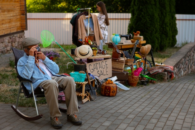 Full shot people at garage sale