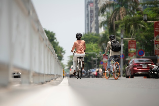 Full shot people going to work on bicycle