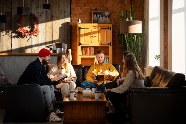 Full shot people reading at book club