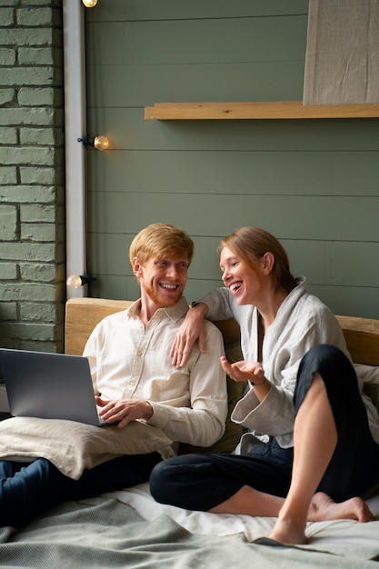 full shot people relaxing indoors