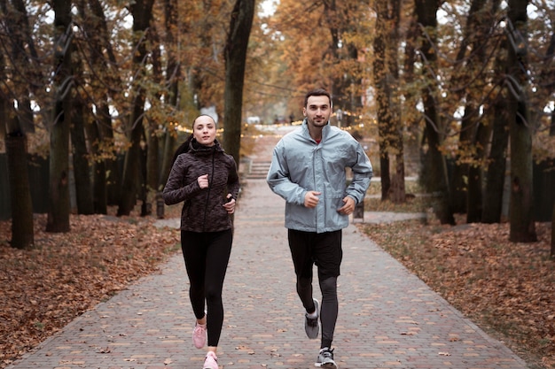 Full shot people running outdoors