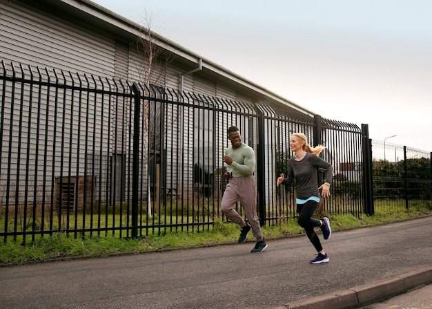 Free photo full shot people running outdoors