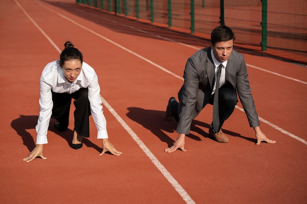 Full shot people running in suits