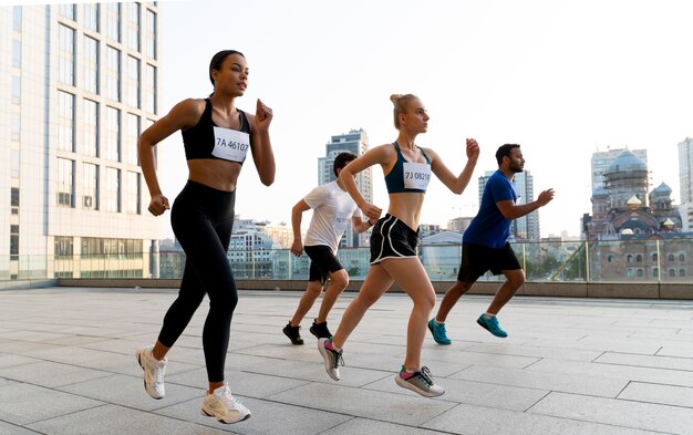 Full shot people running together outside