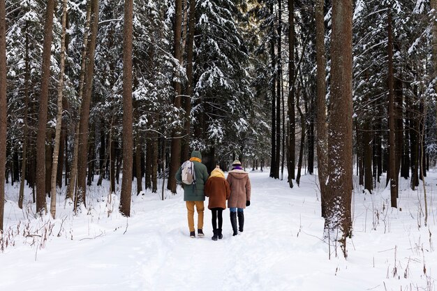 Full shot people walking in nature