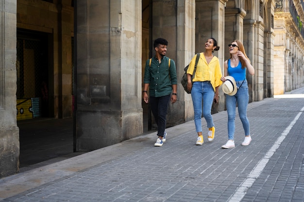 Full shot people walking together outdoors