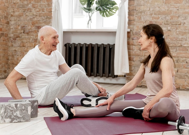 Full shot people on yoga mats